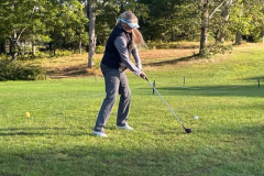 Lisa Mathieu launching a persimmon driver in the Bass-Ackwards